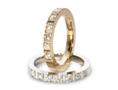 Vigselring Flemming Uziel Signo B072/B072V i 18 k guld med diamant.