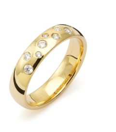 Vigselring Flemming Uziel Signo B029 i 18 k guld med diamanter.