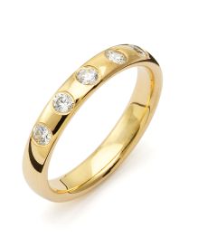 Vigselring Flemming Uziel Signo B036 i 18 k guld med diamanter.