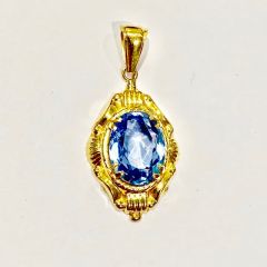 Vintage Guldhänge i 18 K rödguld med en 9 carat Blå Topas.